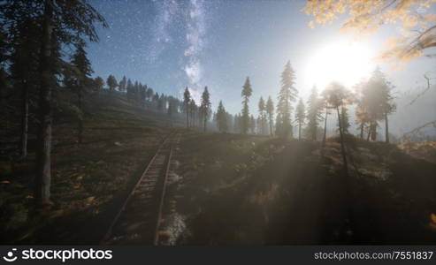 The milky way above the railway and forest