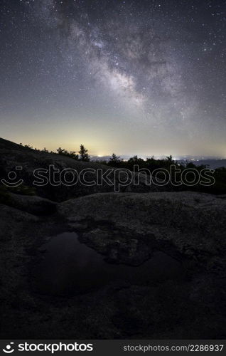 The Milky Way shining over rural Virginia viewed from the summit of Old Rag Mountain in Shenandoah National Park.