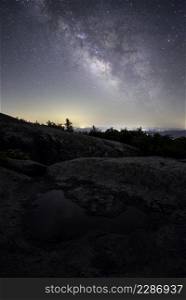 The Milky Way shining over rural Virginia viewed from the summit of Old Rag Mountain in Shenandoah National Park.