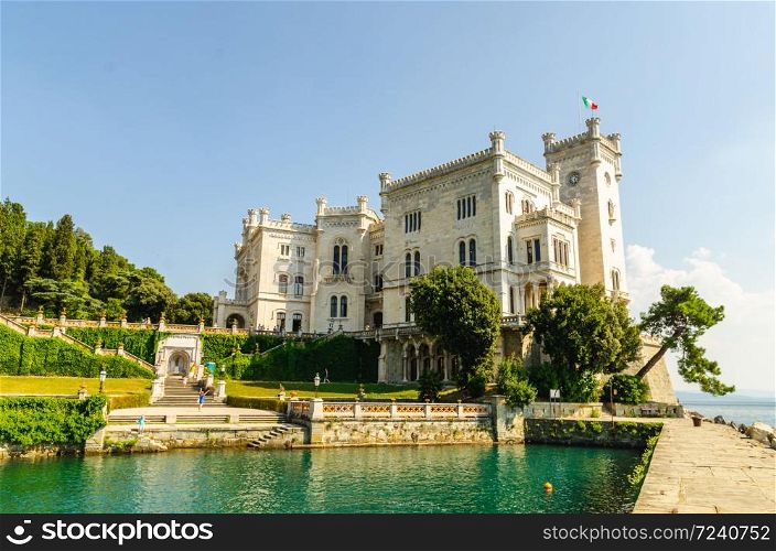 The Miramare Castle in Trieste, Italy, 05.08.2015 a nineteenth-century castle of white stone perched above the Adriatic sea. Italy.. The Miramare Castle in Trieste, a nineteenth-century castle of white stone perched above the Adriatic sea. Italy.