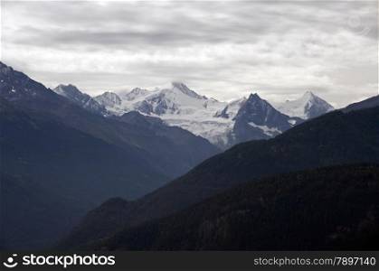 The montains and snow on the tops of the Berner Oberland Alps