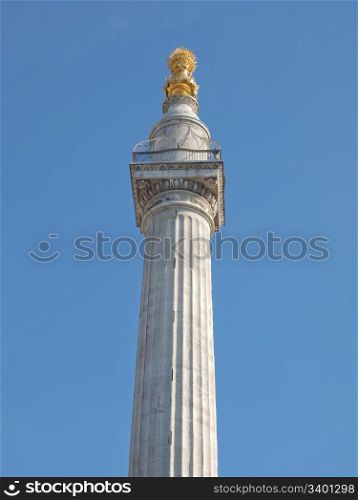 The Monument, London. The Monument to commemorate the Great Fire of London in 1666 - over blue sky background
