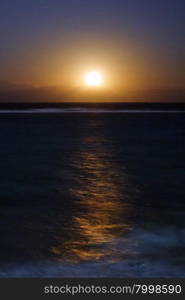 The Moon and sea at night in Dahab, Egypt