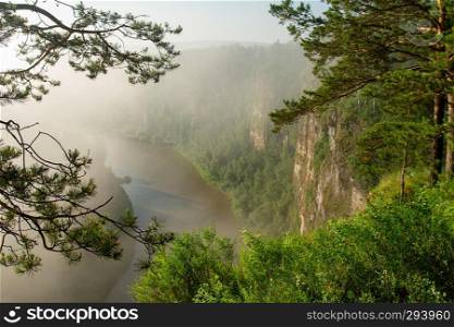 The morning mist rises over the river canyon. Landscape
