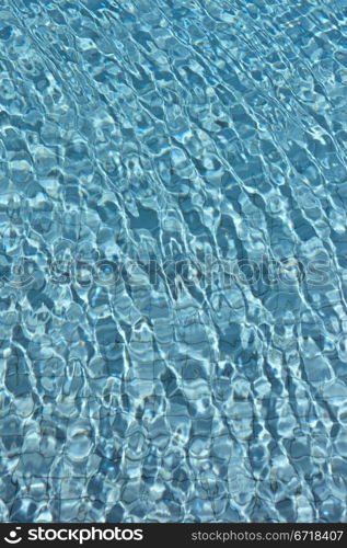 The Most beautiful clear pool water reflecting in the sun