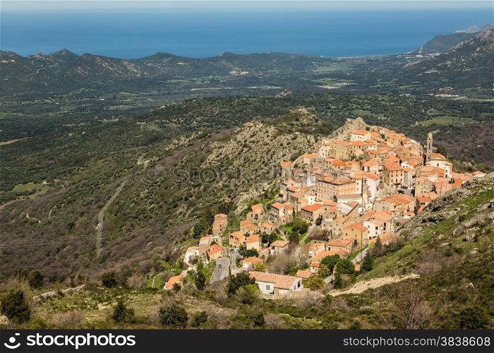 The mountain village of Speloncato in the Balagne region of north Corsica with maquis and the Mediterranean in the background