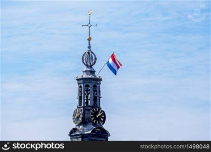 The Munt Tower in Amsterdam the Netherlands at kings day