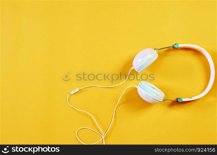 The music headphones on the orange background