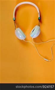 The music headphones on the orange background