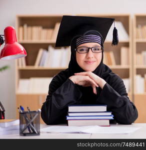 The muslim girl in hijab studying preparing for exams. Muslim girl in hijab studying preparing for exams