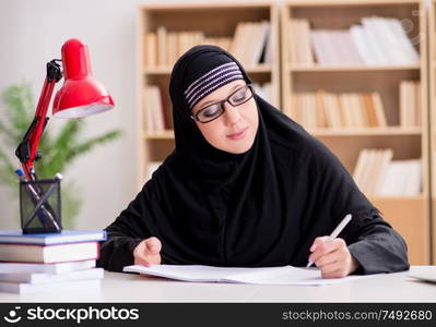 The muslim girl in hijab studying preparing for exams. Muslim girl in hijab studying preparing for exams