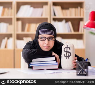 The muslim girl in hijab studying preparing for exams. Muslim girl in hijab studying preparing for exams