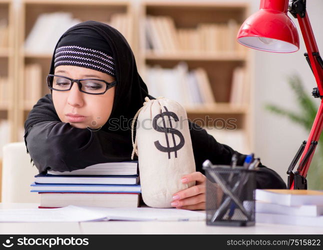 The muslim girl in hijab studying preparing for exams. Muslim girl in hijab studying preparing for exams