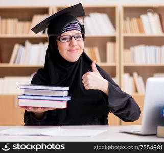 The muslim girl in hijab studying preparing for exams. Muslim girl in hijab studying preparing for exams