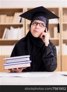 The muslim girl in hijab studying preparing for exams. Muslim girl in hijab studying preparing for exams
