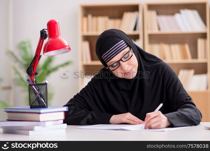 The muslim girl in hijab studying preparing for exams. Muslim girl in hijab studying preparing for exams