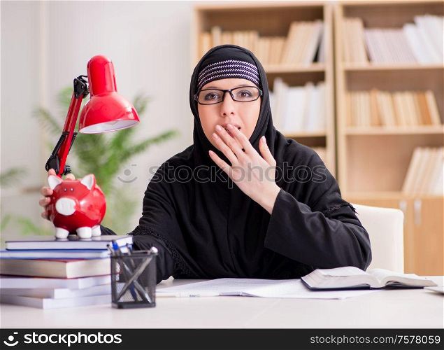 The muslim girl in hijab studying preparing for exams. Muslim girl in hijab studying preparing for exams