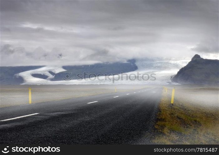 The mystical feel of the road towards the Skaftafel National Park, with a view on the clearly lit Vatnajokull glacier&rsquo;s runners, the Skaftafellsjokull and the Svinafellsjokull