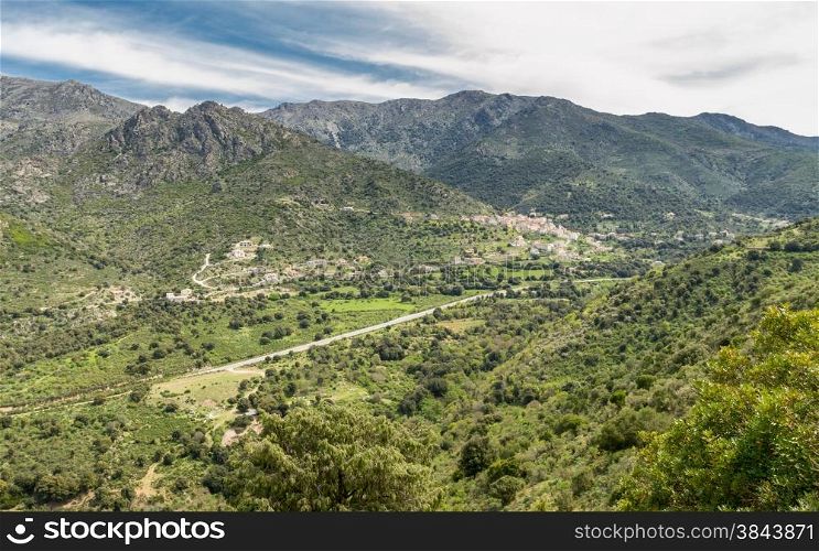 the N197 road passes through a valley as it heads towards the coast in the Balagne region of Corsica