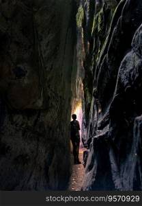 The narrow rock crevice named &rsquo;kuelscheier&rsquo; in the forest close to the village of Consdorf, popular with tourists, Mullerthal region, in luxembourg