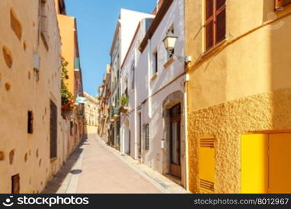 The narrow traditional street in the tourist town of Tossa de Mar.. Tossa de Mar. The traditional city street.