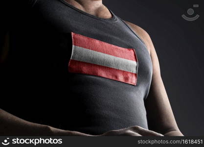 The national flag of Austria on the athlete’s chest.. The national flag of Austria on the athlete’s chest