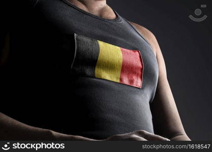 The national flag of Belgium on the athlete’s chest.. The national flag of Belgium on the athlete’s chest