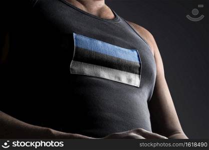 The national flag of Estonia on the athlete’s chest.. The national flag of Estonia on the athlete’s chest