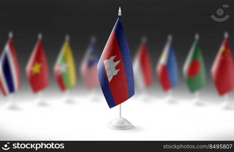 The national flag of the Cambodia on the background of flags of other countries.. The national flag of the Cambodia on the background of flags of other countries