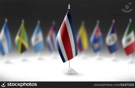 The national flag of the Costa Rica on the background of flags of other countries.. The national flag of the Costa Rica on the background of flags of other countries