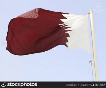 The national flag of the Emirate of Qatar, in Arabia