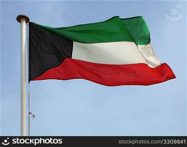 The national flag of the Gulf oil emirate of Kuwait.