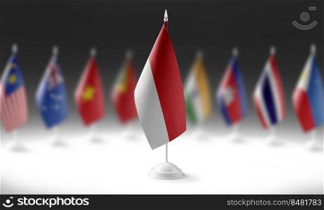 The national flag of the Indonesia on the background of flags of other countries.. The national flag of the Indonesia on the background of flags of other countries