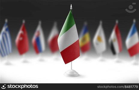 The national flag of the Italy on the background of flags of other countries.. The national flag of the Italy on the background of flags of other countries