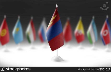 The national flag of the Mongolia on the background of flags of other countries.. The national flag of the Mongolia on the background of flags of other countries