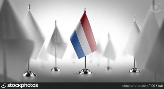The national flag of the Netherlands surrounded by white flags.. The national flag of the Netherlands surrounded by white flags
