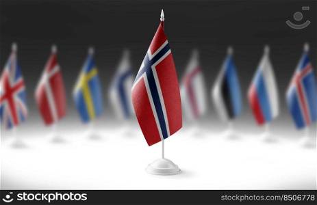 The national flag of the Norway on the background of flags of other countries.. The national flag of the Norway on the background of flags of other countries