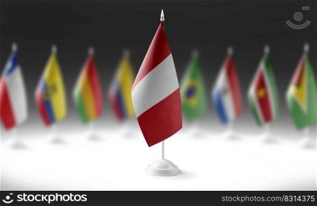 The national flag of the Peru on the background of flags of other countries.. The national flag of the Peru on the background of flags of other countries