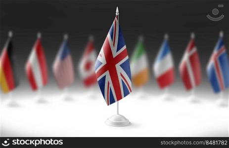 The national flag of the United Kingdom on the background of flags of other countries.. The national flag of the United Kingdom on the background of flags of other countries