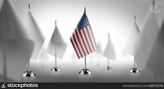 The national flag of the United States surrounded by white flags.. The national flag of the United States surrounded by white flags