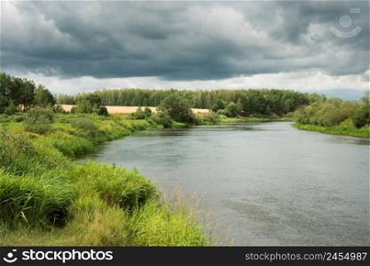 The nature of Belarus - a calm summer landscape on the banks of the Berezina River. Summer landscape