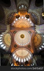 The New Mosque (Yeni Valide Camii, Ottoman Imperial Mosque), impressive interior ceiling architecture in Istanbul, Turkey