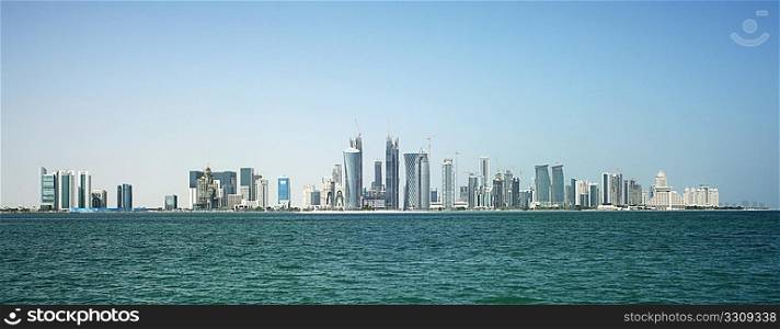 The new skyline of the Qatari capital city, Doha, seen from close to the harbour around which the original city arose.