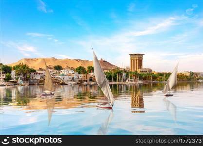 The Nile and sailboats in Aswan, Egypt, summer scenery.