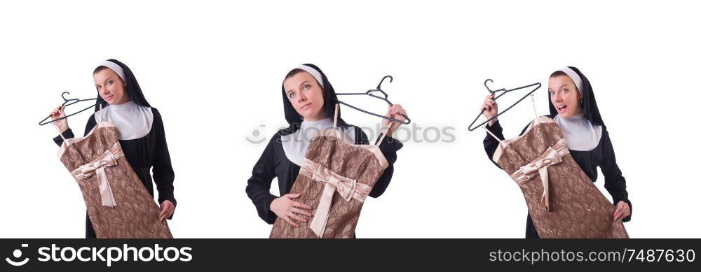 The nun choosing clothing on the hanger isolated on white. Nun choosing clothing on the hanger isolated on white