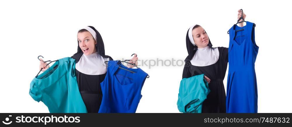 The nun choosing clothing on the hanger isolated on white. Nun choosing clothing on the hanger isolated on white