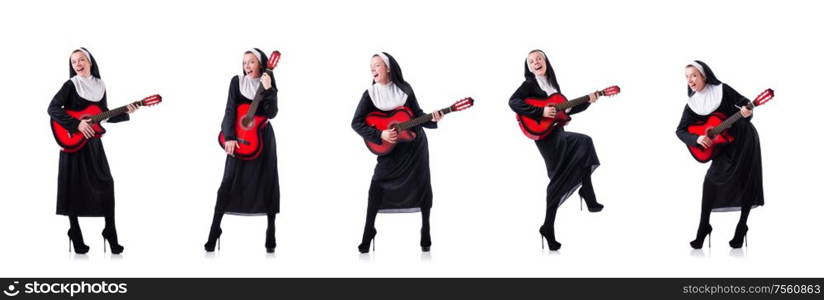 The nun playing guitar isolated on white. Nun playing guitar isolated on white