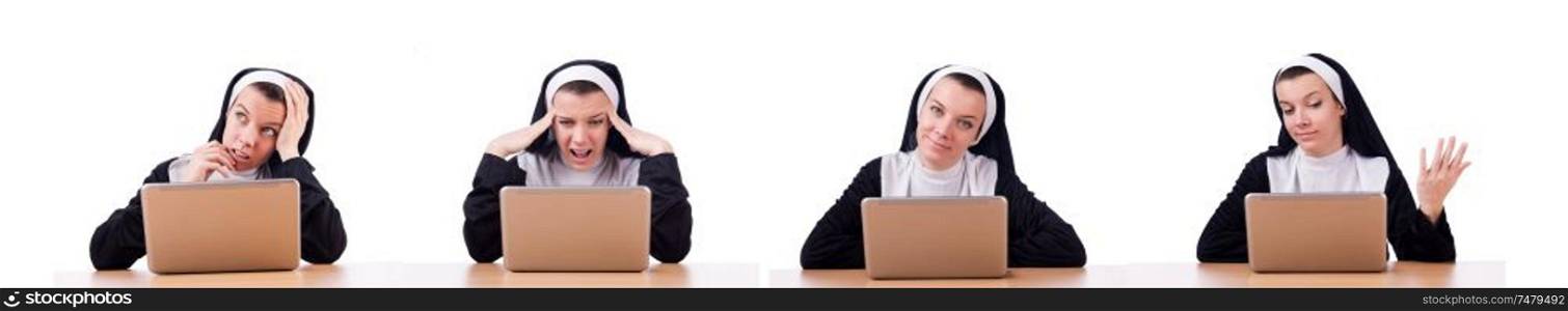 The nun working on laptop - religious concept. Nun working on laptop - religious concept