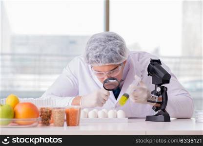 The nutrition expert testing food products in lab. Nutrition expert testing food products in lab
