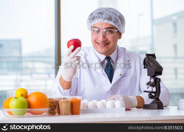 The nutrition expert testing food products in lab. Nutrition expert testing food products in lab